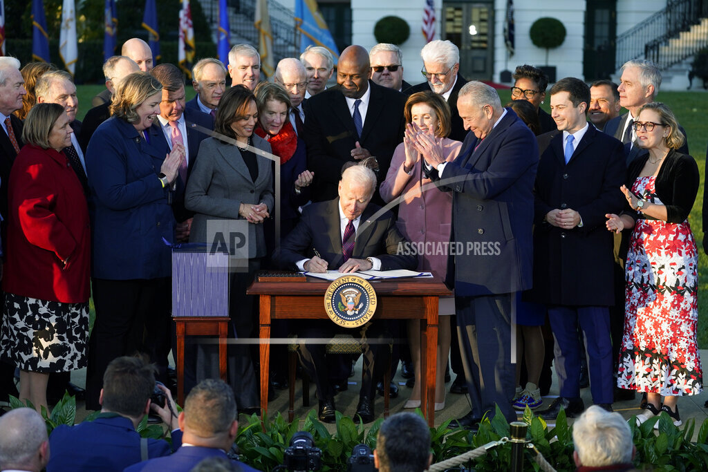 President Joe Biden signs the Infrastructure Investment and Jobs Act